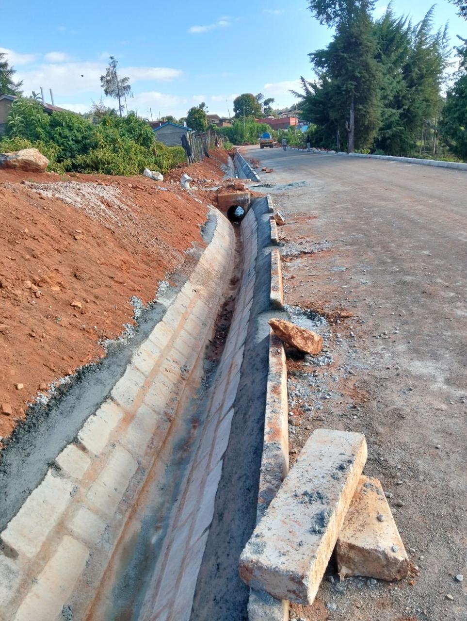 Road formation and masonry-lined drainage construction